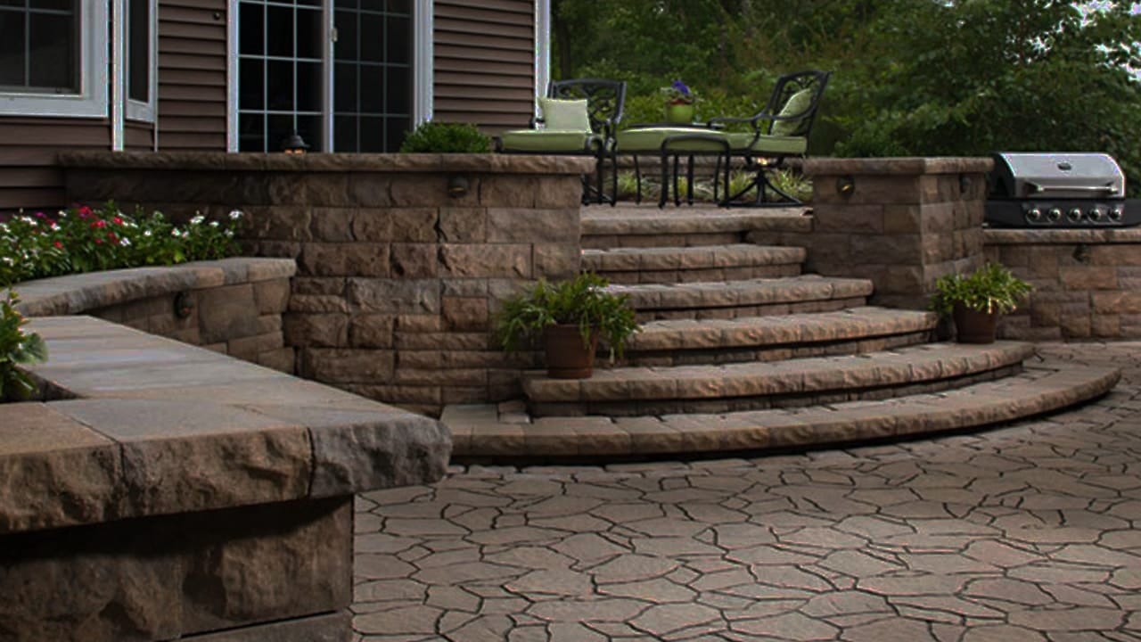 Paver Installations 1 Paved outdoor area with curved steps and surrounding walls