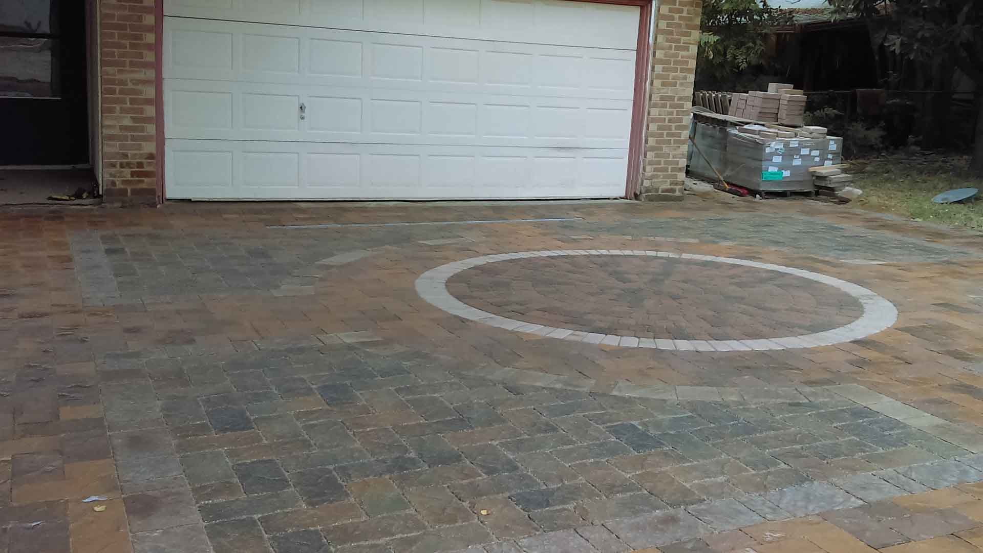Keystone Hardscapes Custom Paver Driveway With Circular Inlay Design
