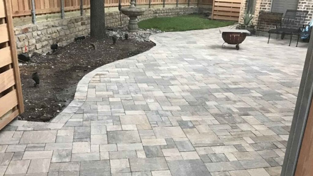 Paver patio with a curved planting-bed edge