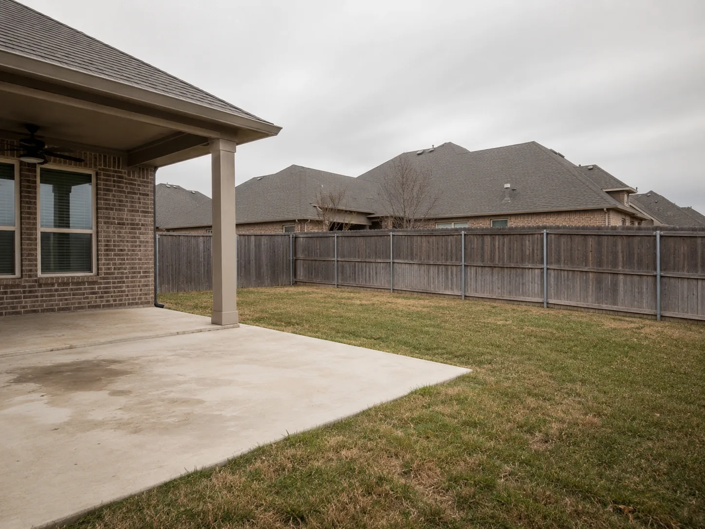 Paving Texas Construction 10 Empty backyard with no outdoor gathering area or fire feature